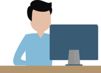 Person am Schreibtisch vor einem Computer